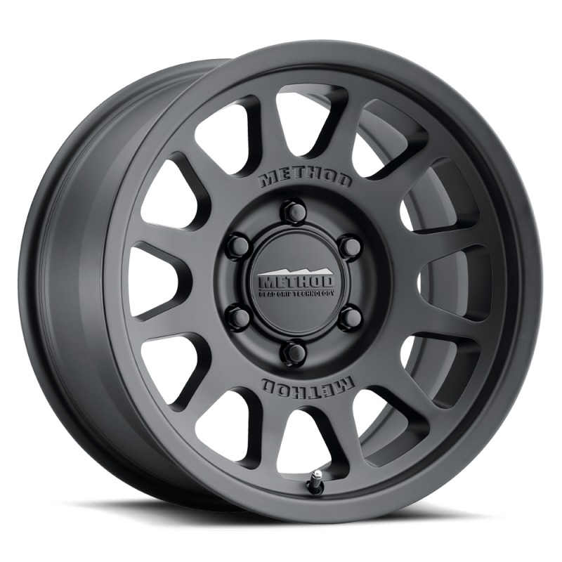 MR703 17x8.5 +25mm Offset 6x135 87mm CB Matte Black Wheel - Click Image to Close