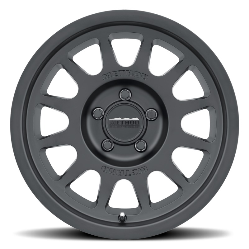 MR703 15x7 +15mm Offset 5x100 56.1mm CB Matte Black Wheel - Click Image to Close